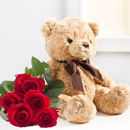 7 roses and teddy bear